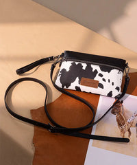 Wrangler Cow-Print Crossbody Clutch in COW-BK