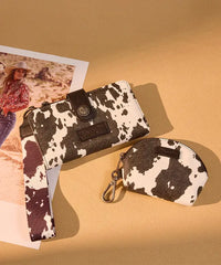 Wrangler cow-print dual pouch wristlet in BK