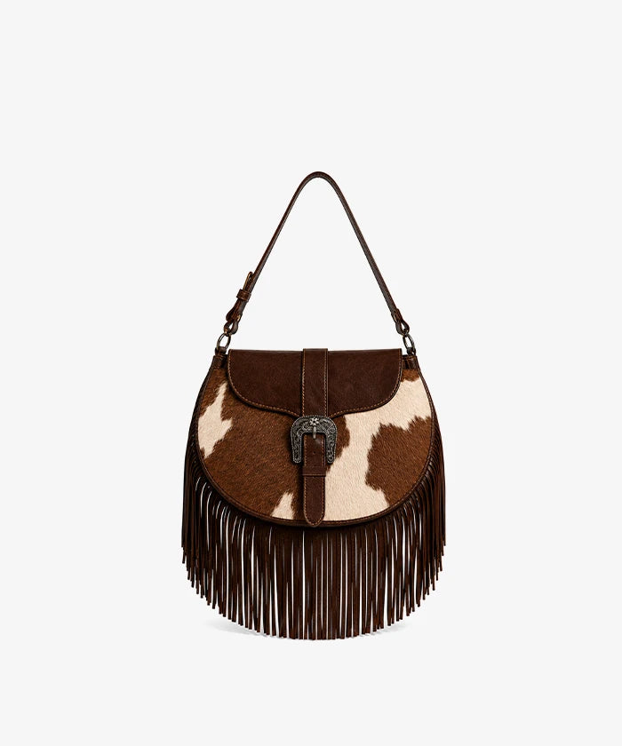 Trinity Ranch Cowhide Saddle Bag — genuine leather with cowhide print and fringe