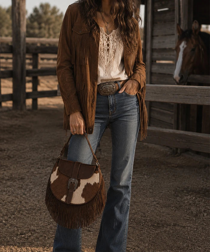 Trinity Ranch Cowhide Saddle Bag — genuine leather with cowhide print and fringe