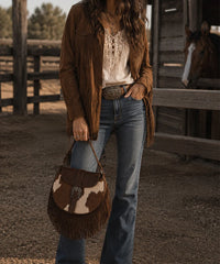 Trinity Ranch Cowhide Saddle Bag — genuine leather with cowhide print and fringe