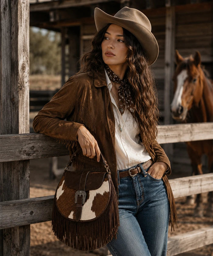 Trinity Ranch Cowhide Saddle Bag — genuine leather with cowhide print and fringe