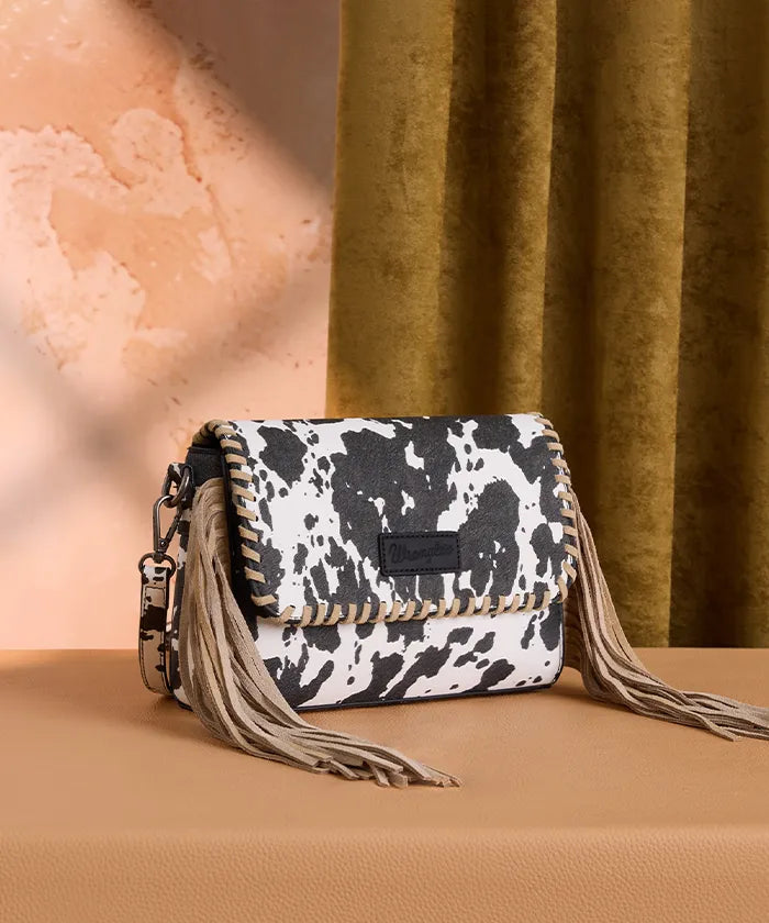 Wrangler cow print flap crossbody bag in BK