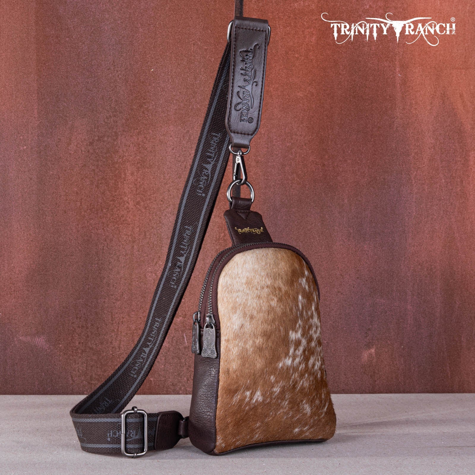 TR159-210 Trinity Ranch Genuine Hair-On Cowhide  Collection Sling Bag - Montana West World